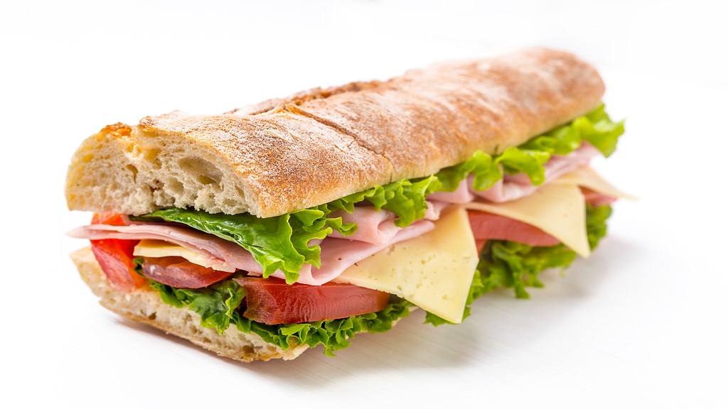 Long Baguette Sandwich with Lettuce, Tomatoes, Ham and Cheese cu